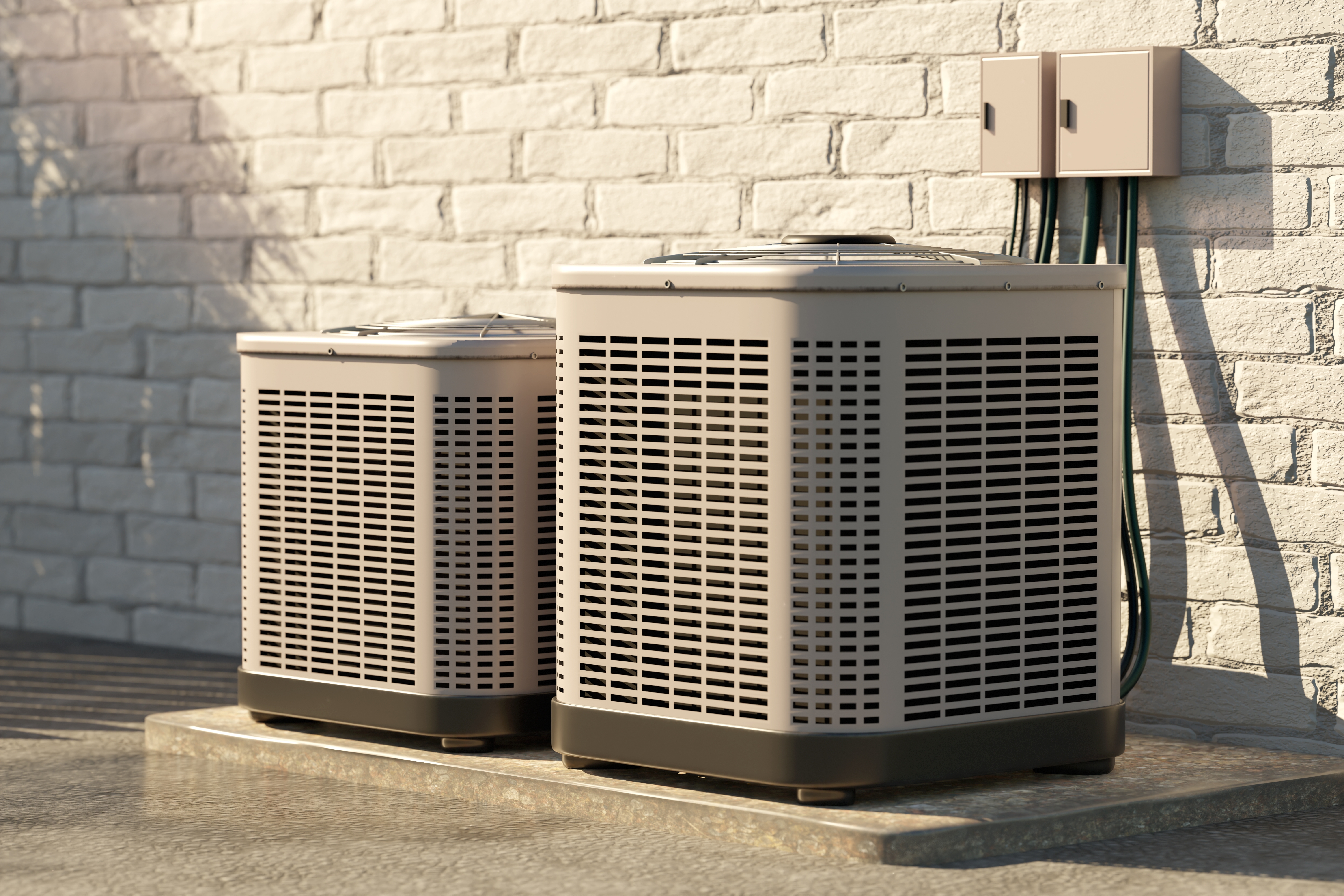 Tips for Reducing Air Conditioning Costs blog header image hvac units outside house up against a white brick wall