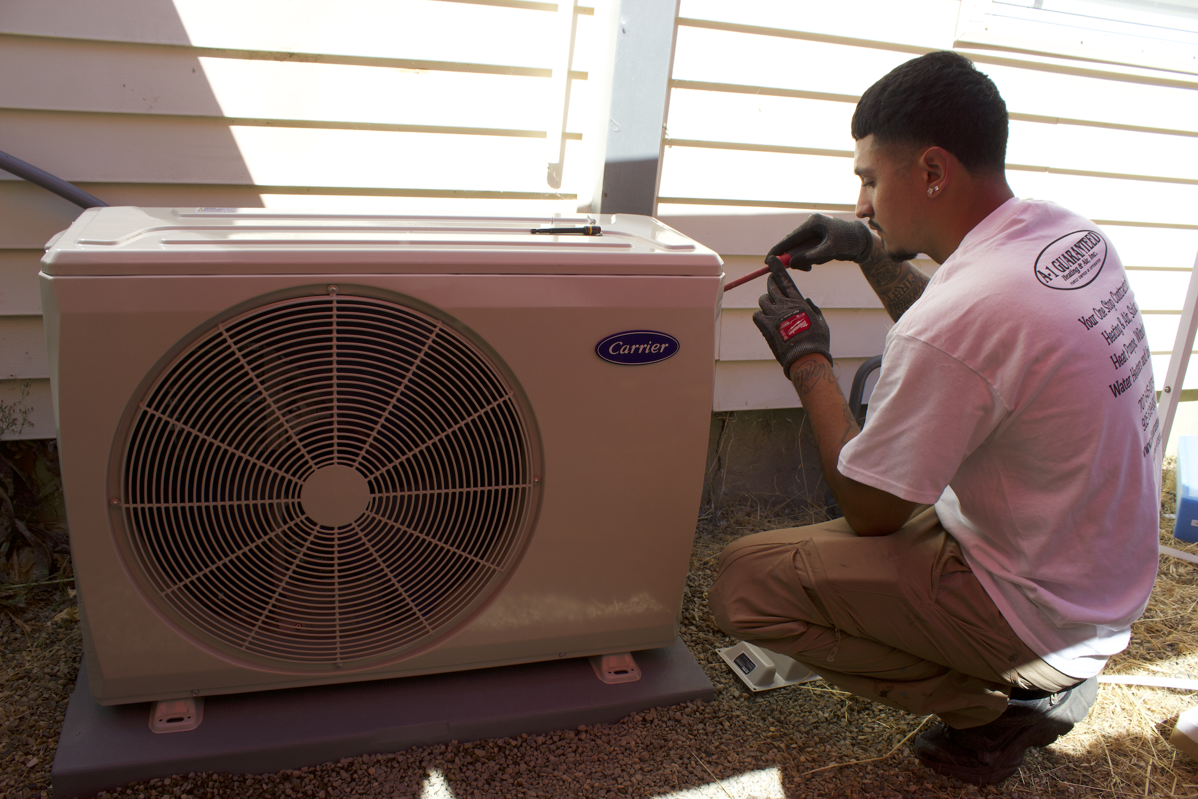 HVAC Technician Installing Heat Pump