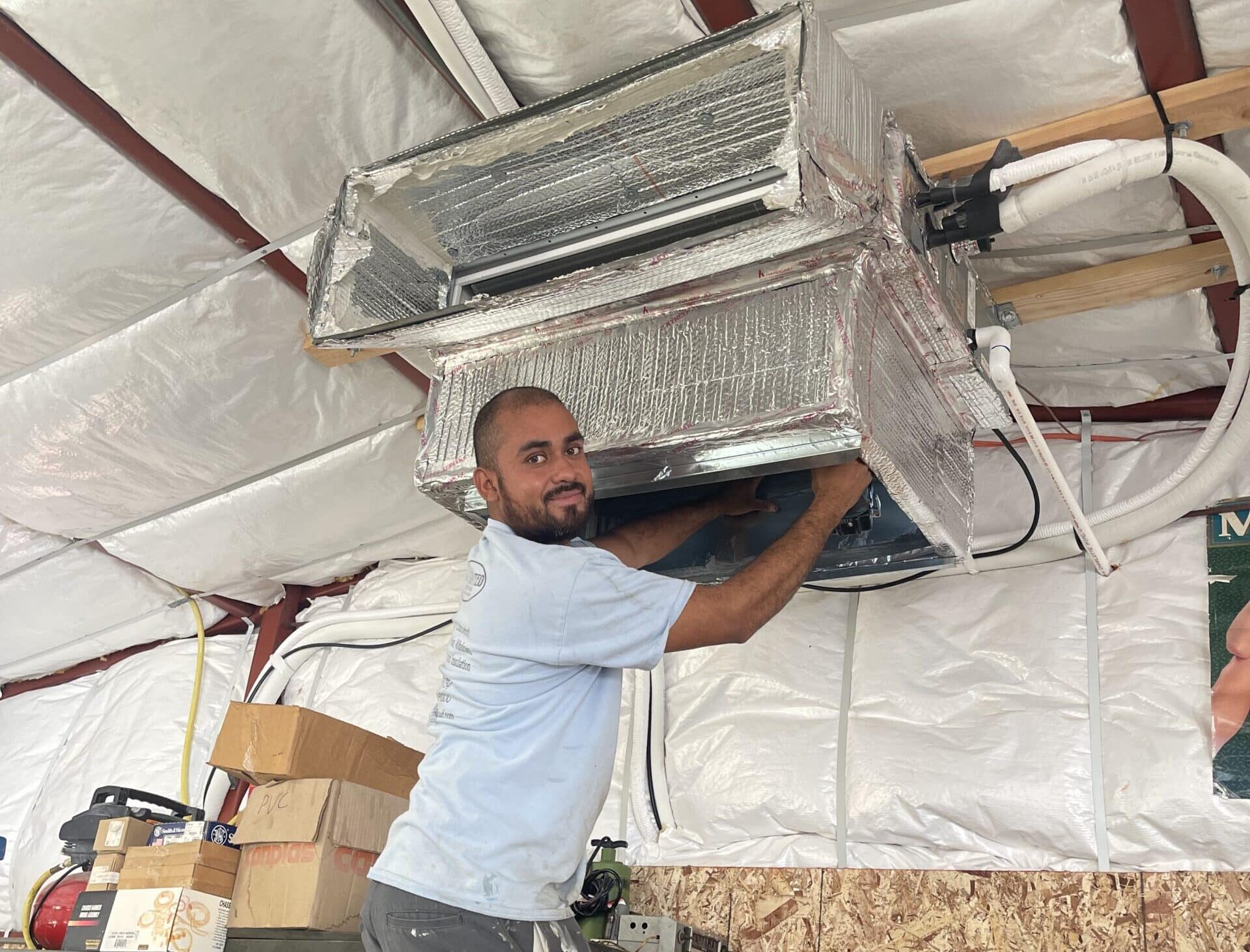 A-1 Guaranteed team member working on HVAC equipment
