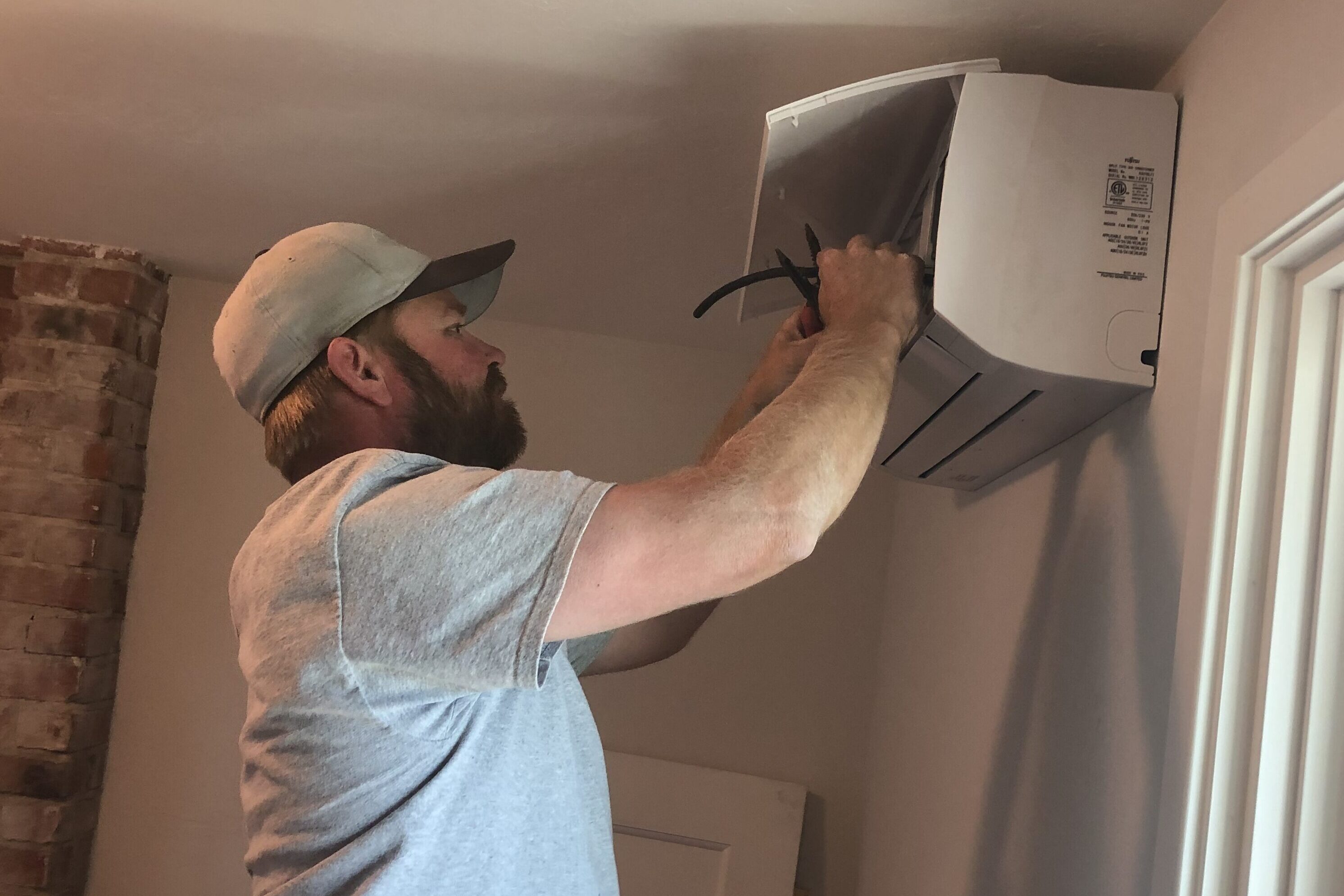 A-1 Guaranteed team member installing mini split in home