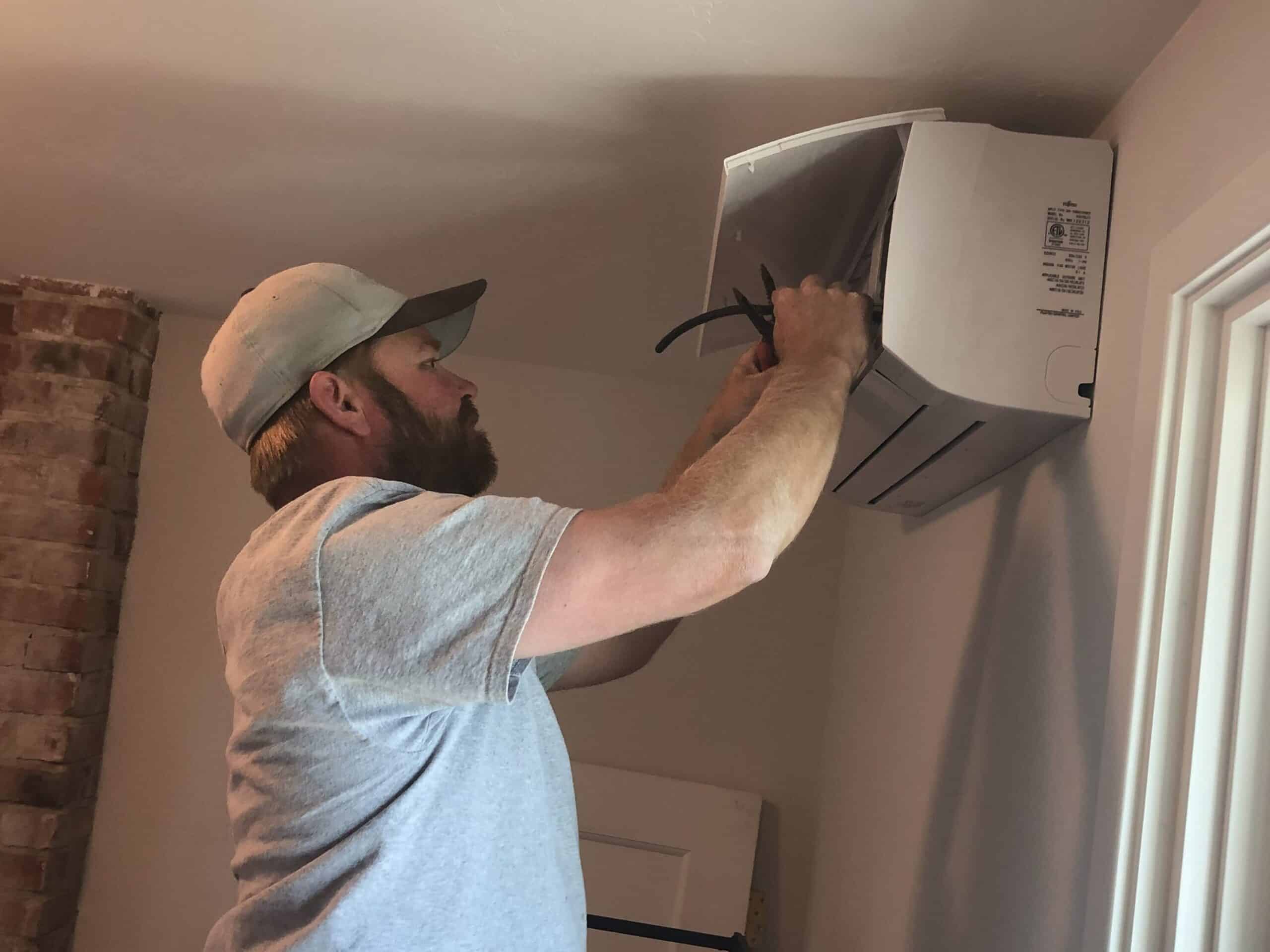 A-1 Guaranteed team member installing mini split in home